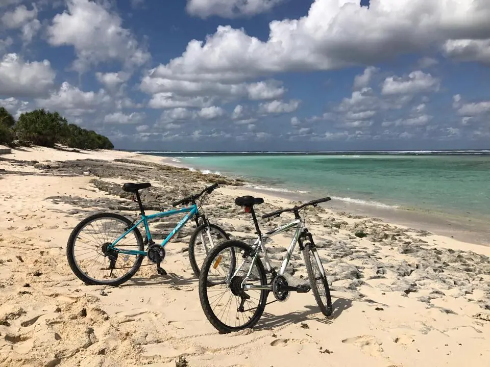 Mountain bikes on a white sand beach in Rote Island