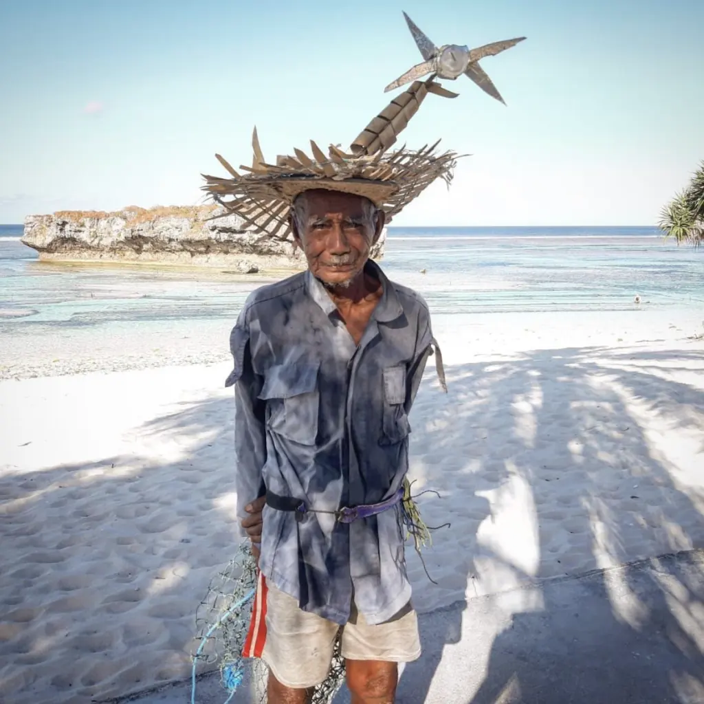 Rotenese man wearing the traditional ti'i langga hat on the beach