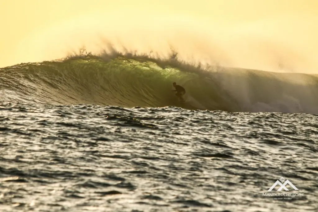 Surfer in the barrel at Sucky Mama, Rote Island