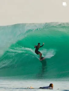 Surfer riding a turquoise wave in Rote Island, from Manduna's Instagram
