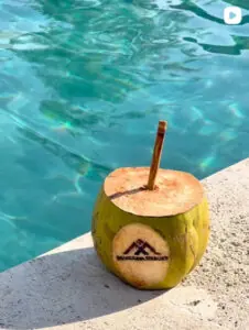 Fresh coconut by the pool at Manduna Resort