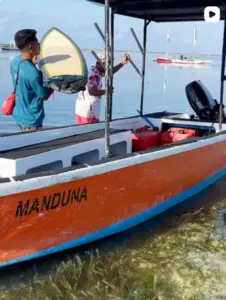 Guests on the Manduna surf boat